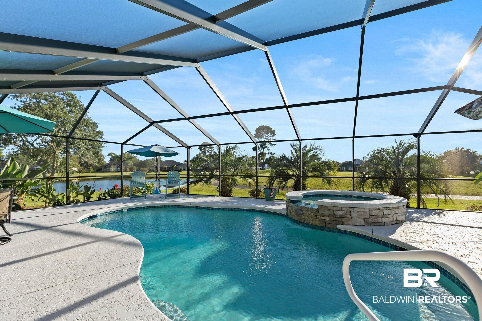 Image 3: Screened in pool and spa