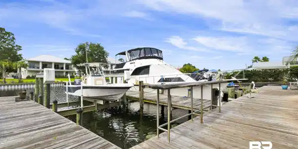 Image 3: Expansive wood dockage with direct water access