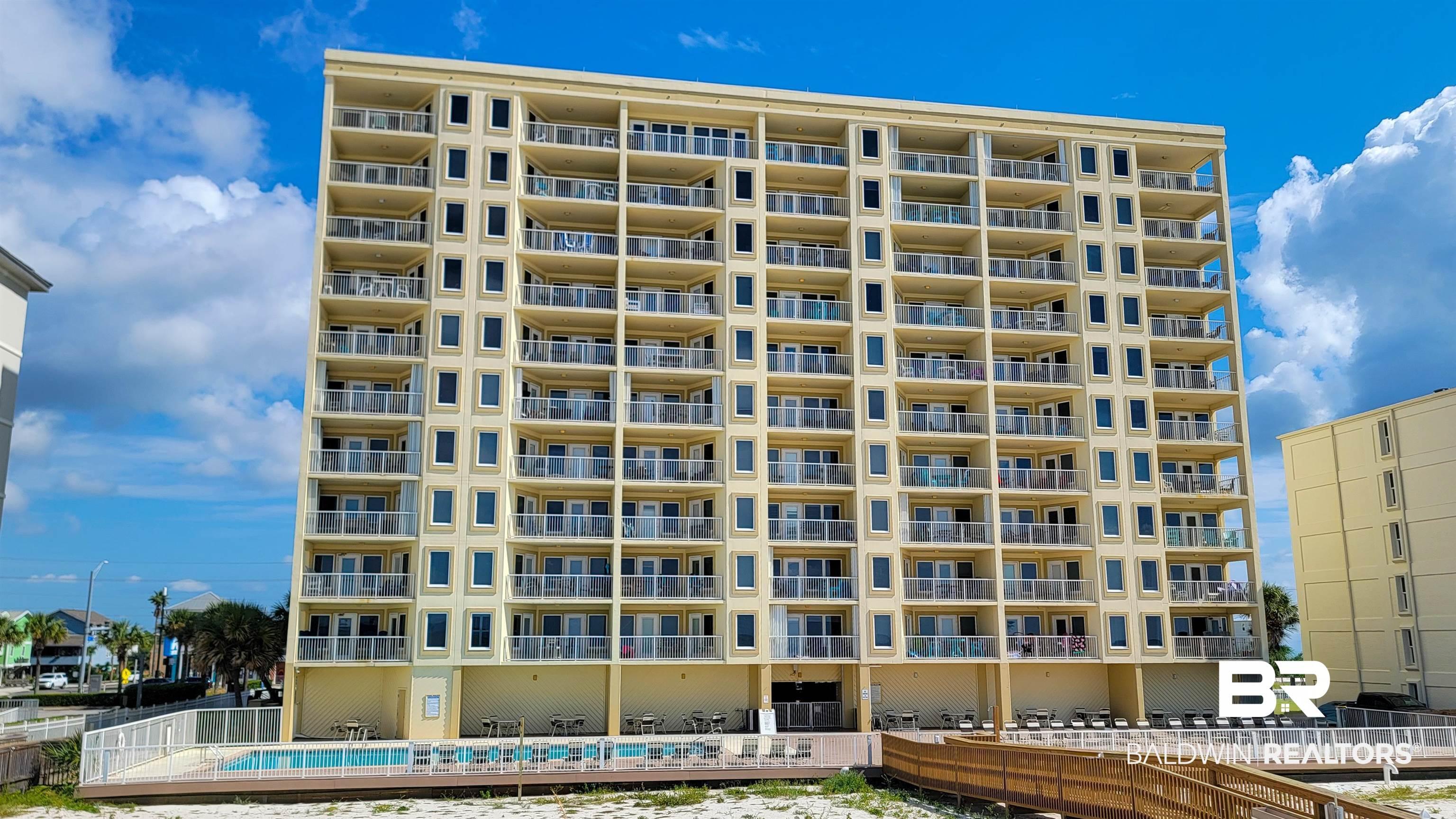 Image 2: View of apartment building / complex with a community pool