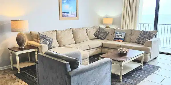 Image 4: Living area featuring a textured ceiling, ceiling fan, and tile patterned floors
