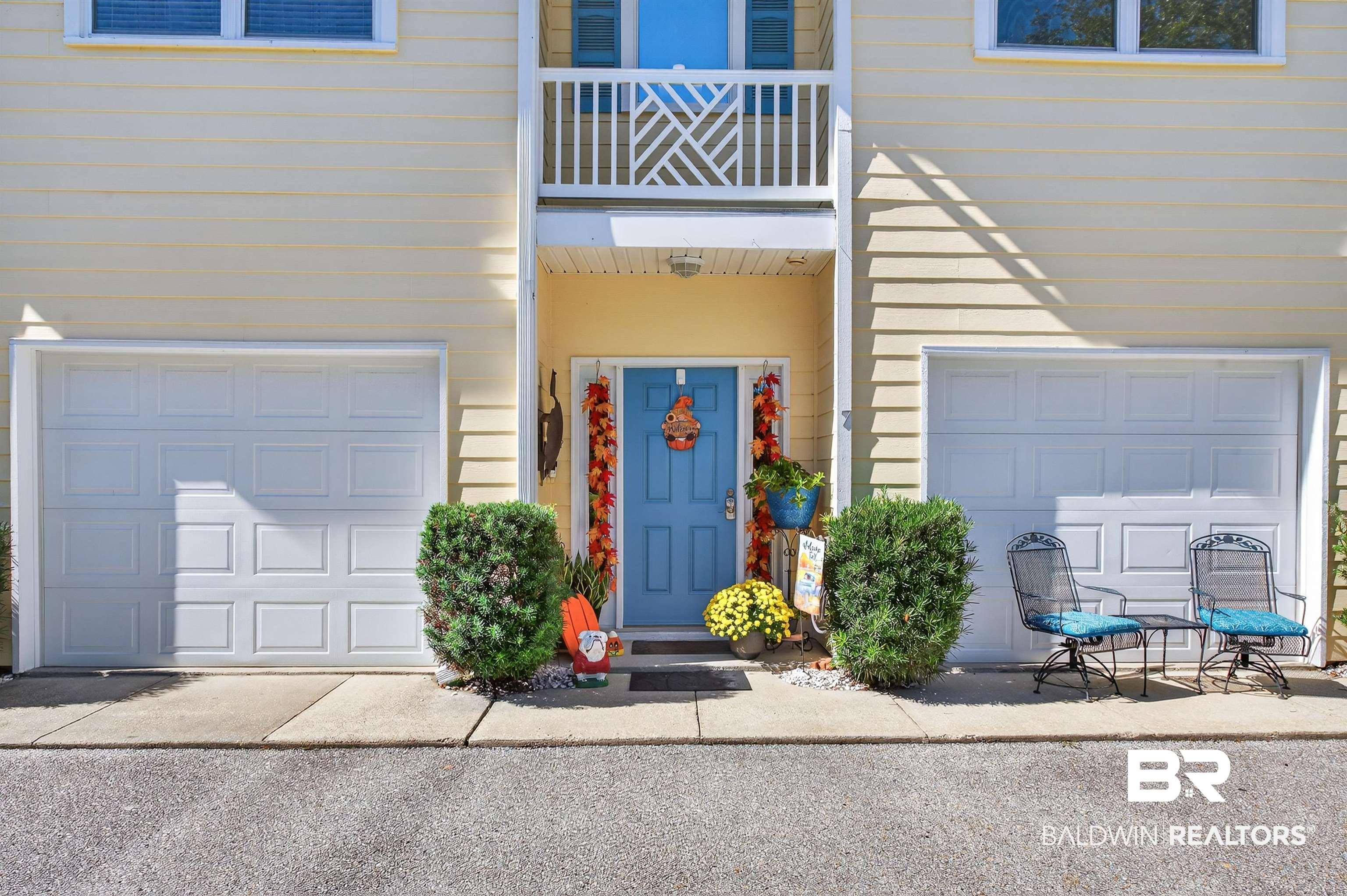 Image 3: View of exterior entry featuring a garage