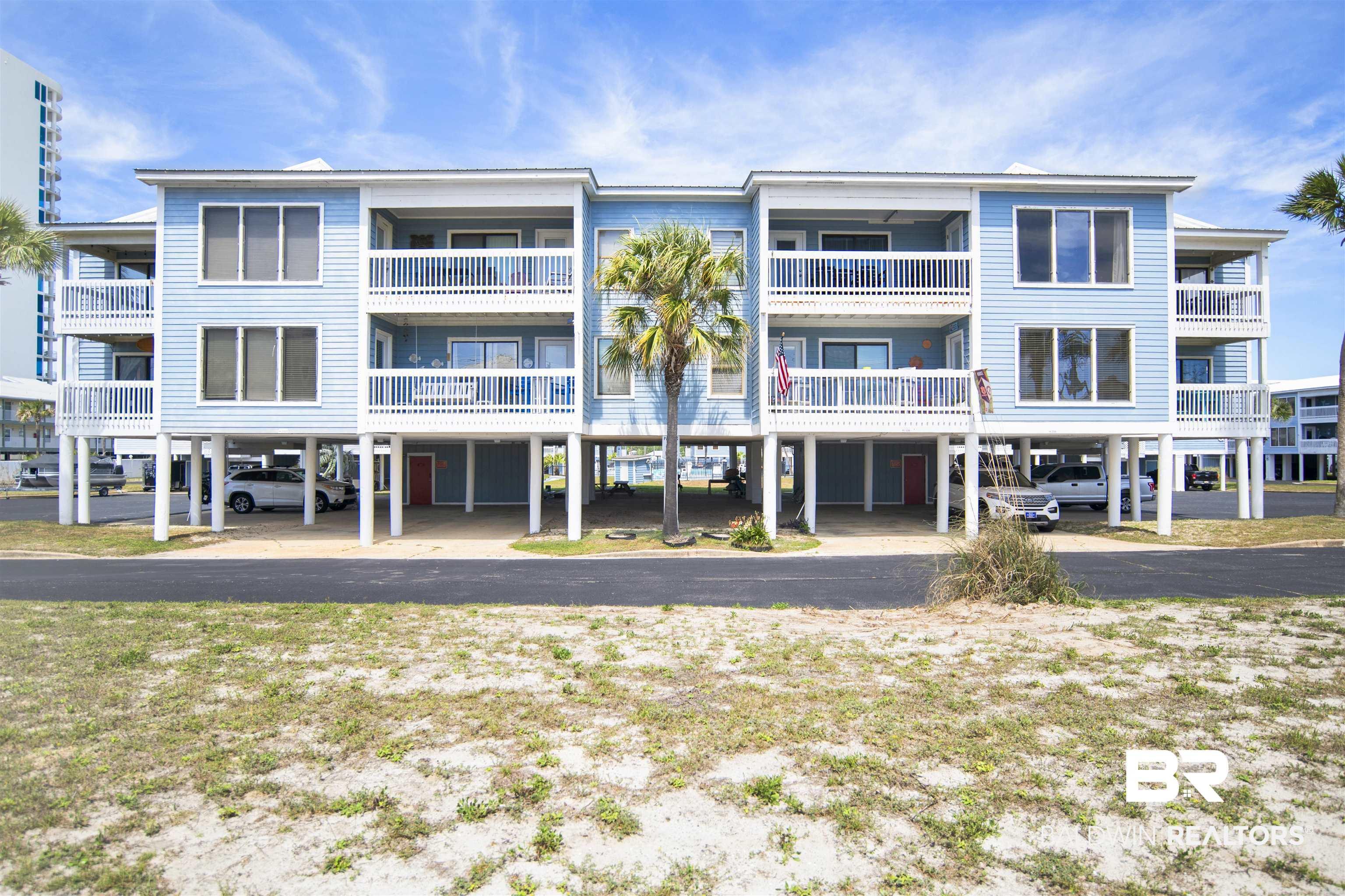 Image 3: View of apartment building / complex featuring a carport