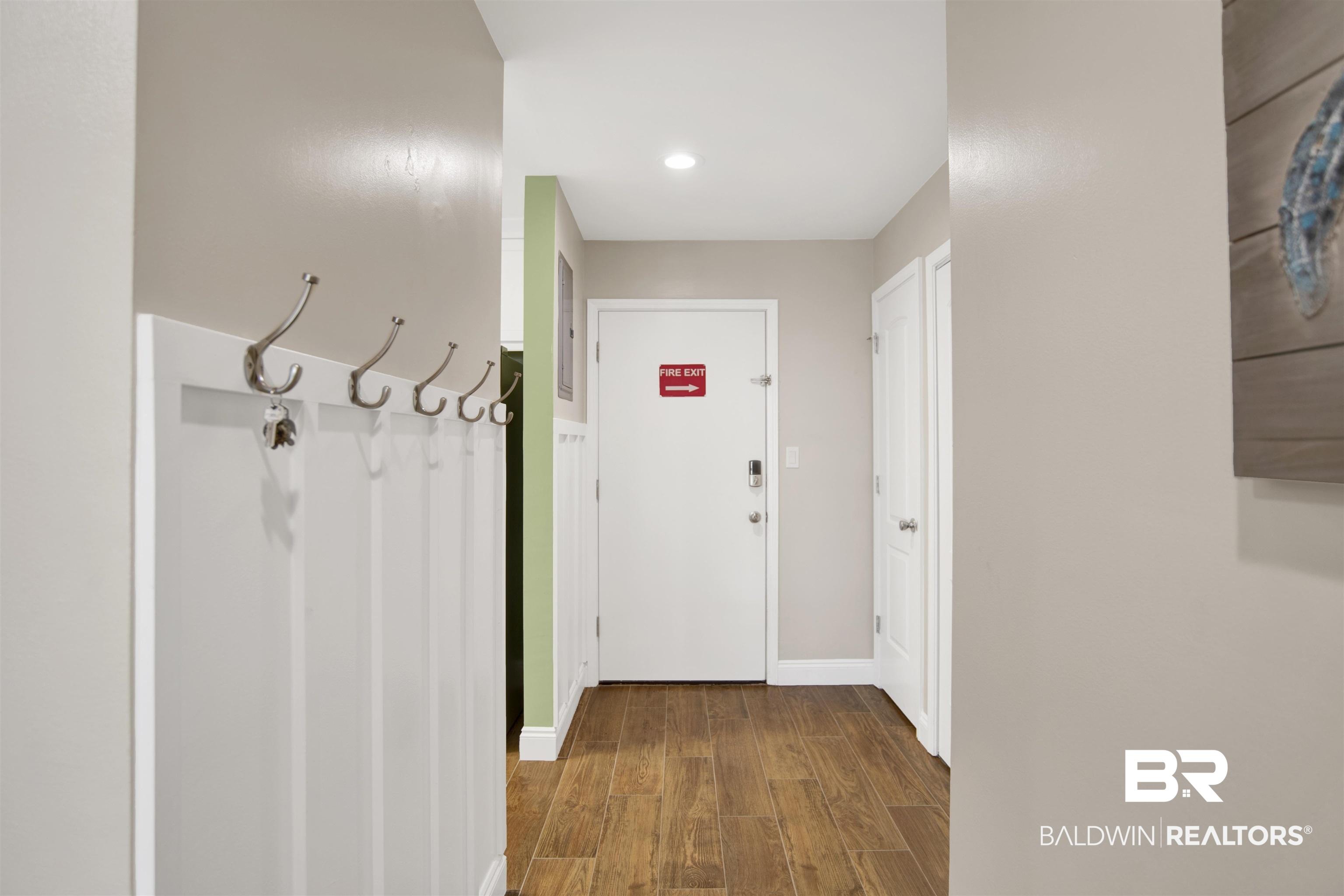 Image 4: Doorway with wood finished floors and recessed lighting