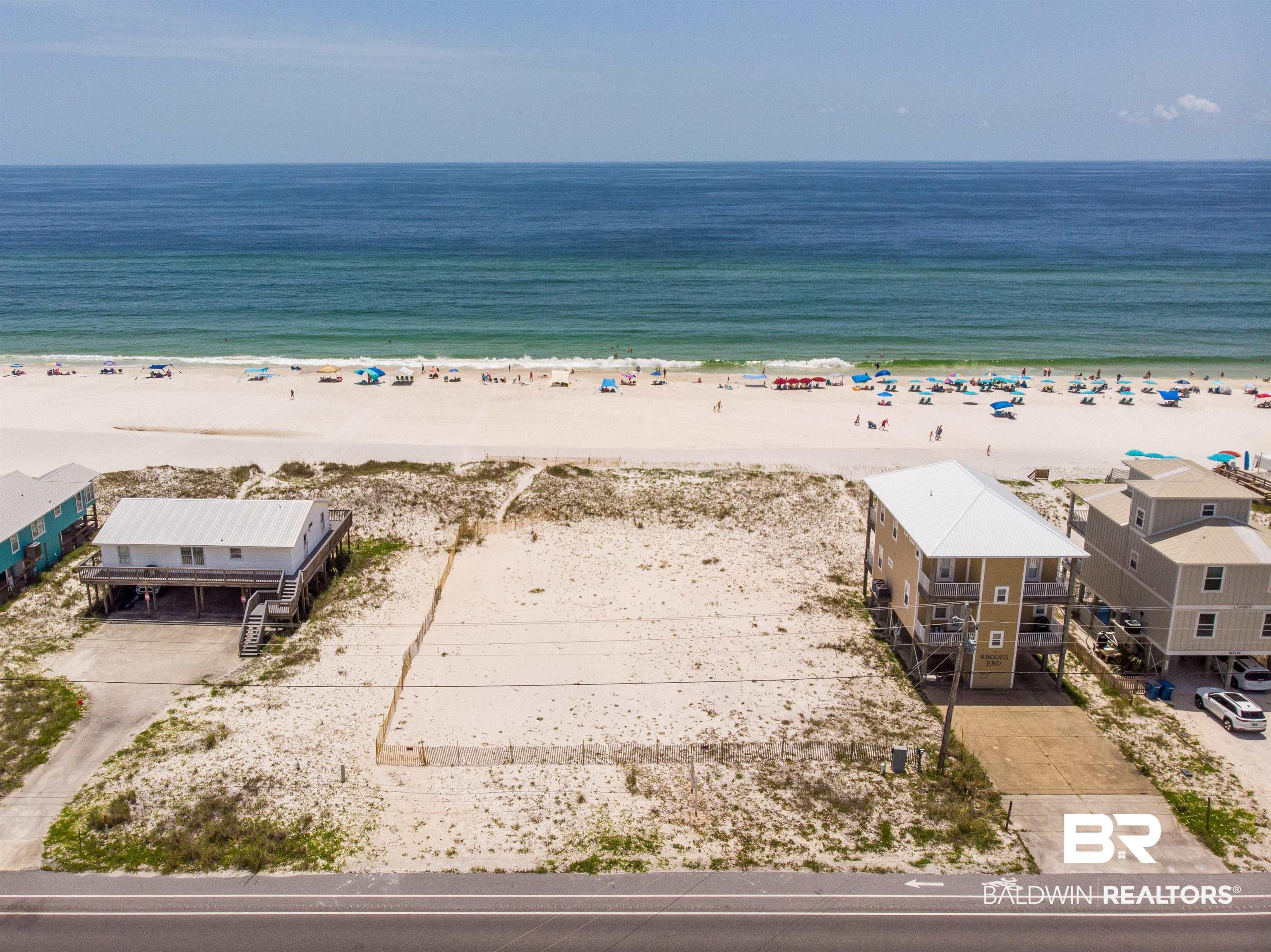 Image 1: Birds eye view of property with a view of the beach and a water view