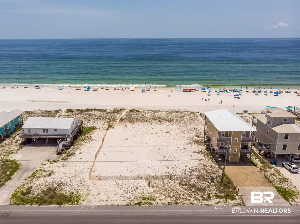 Image 1: Birds eye view of property with a view of the beach and a water view