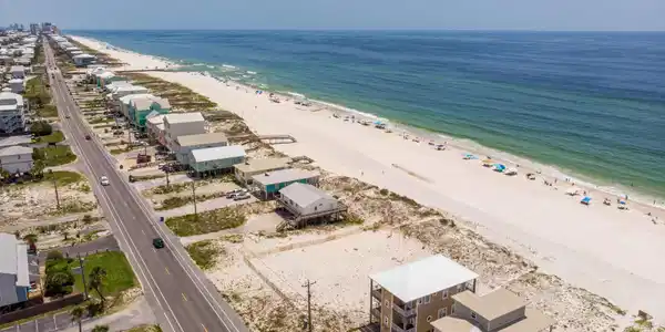 Image 3: Bird's eye view featuring a water view and a beach view