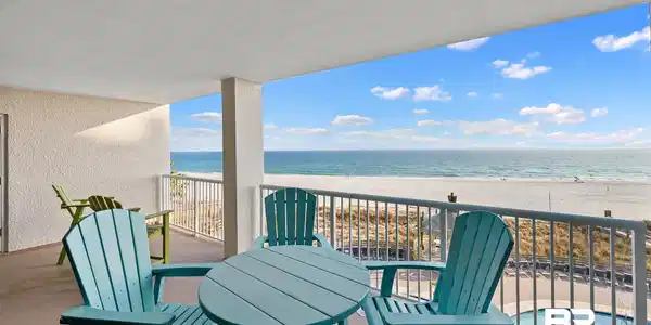 Image 2: Balcony featuring view of water and beach