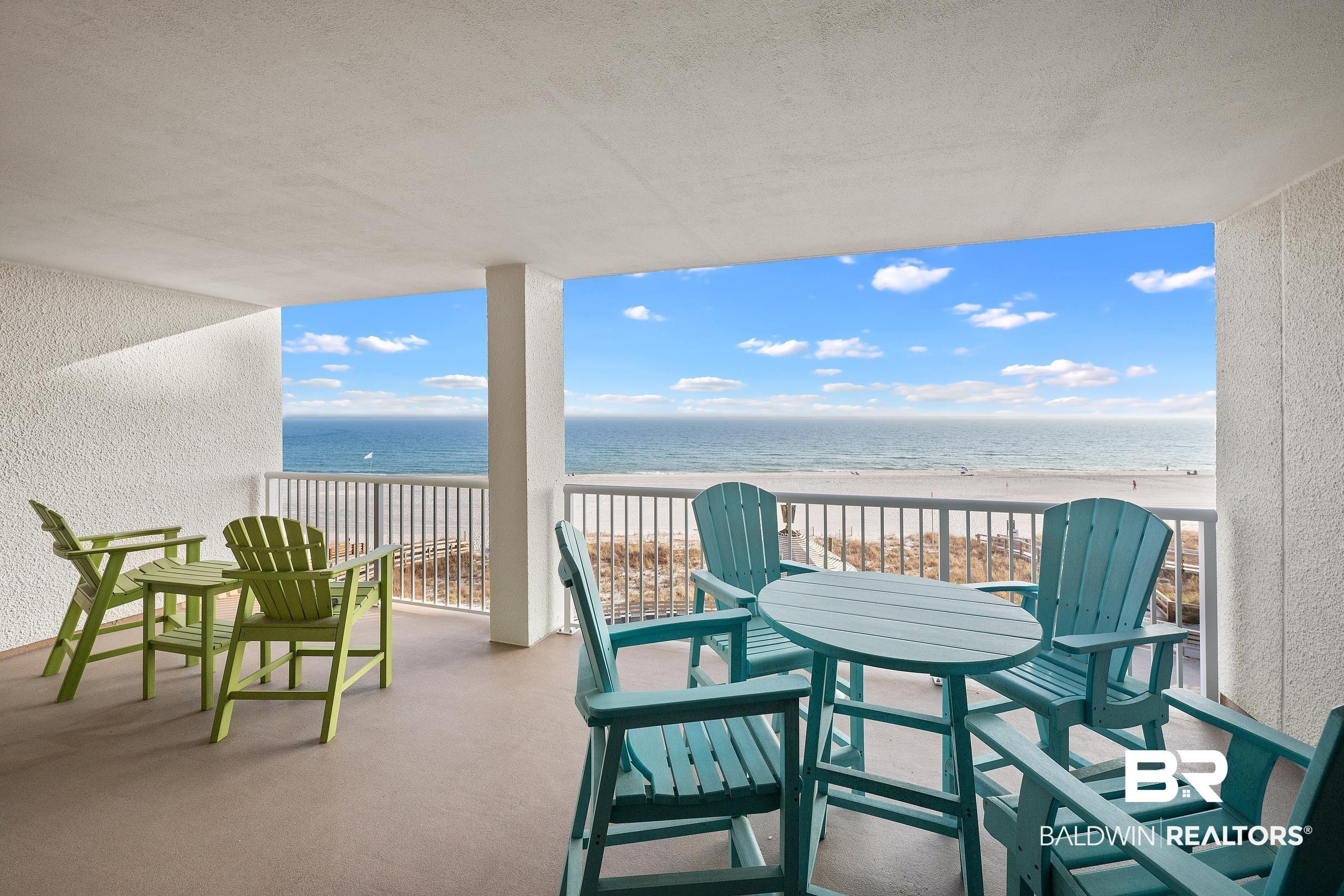 Image 3: Balcony with view of water and beach