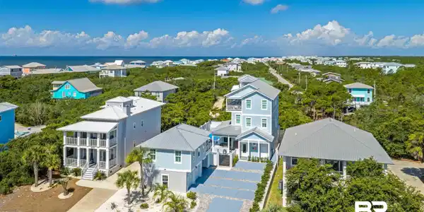 Image 2: Coastal community featuring a collection of properties amidst lush natural landscaping