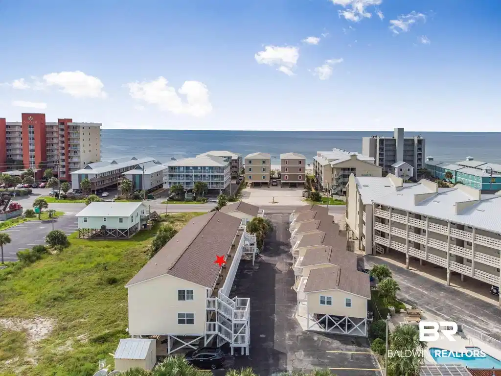 Image 1: Drone / aerial view of a large body of water and apartment complex / building