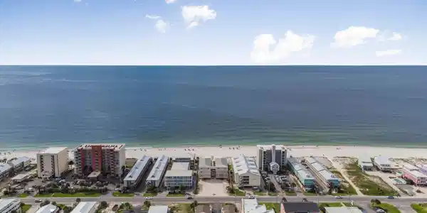 Image 2: Aerial view of expansive beach