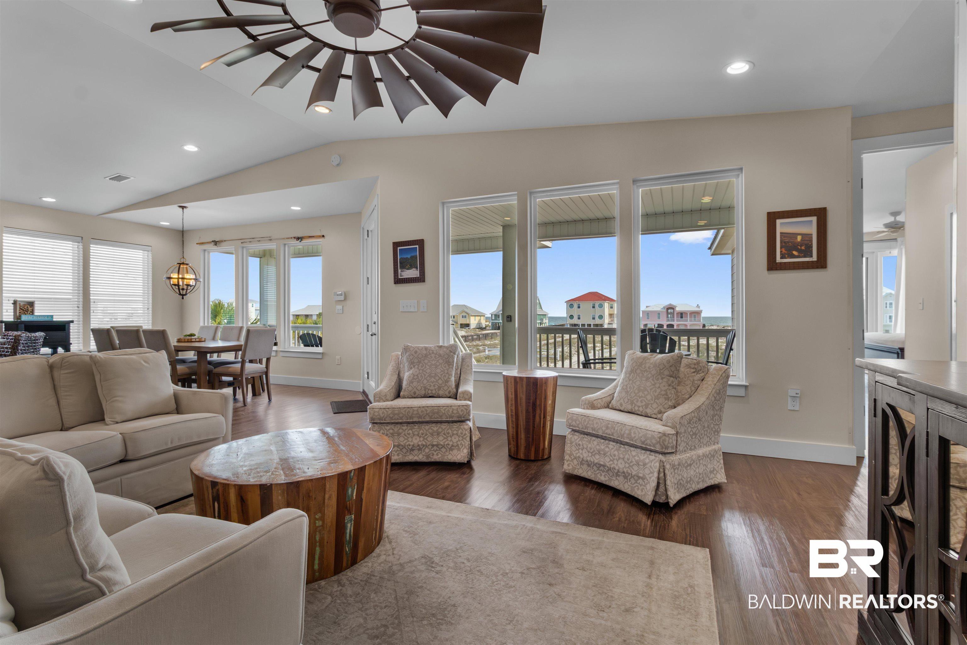 Image 3: Laminate Flooring, Designer Windmill Style Fan, Large South Facing Windows to maximize the Views!