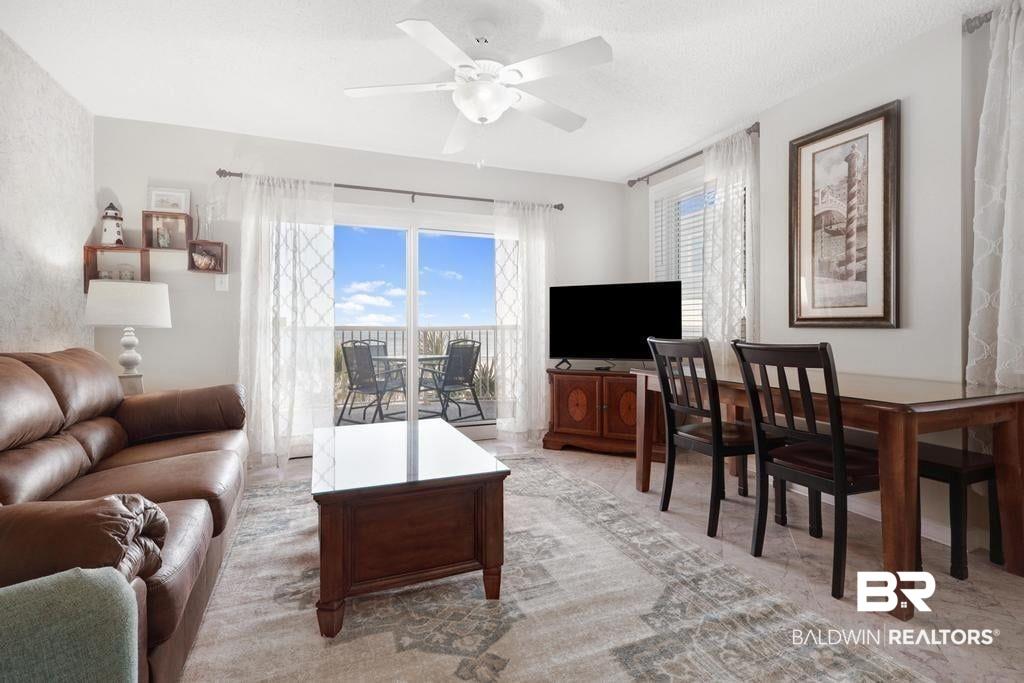 Image 3: Living room featuring ceiling fan