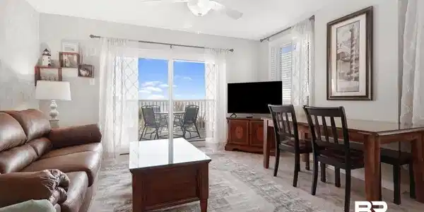 Image 3: Living room featuring ceiling fan