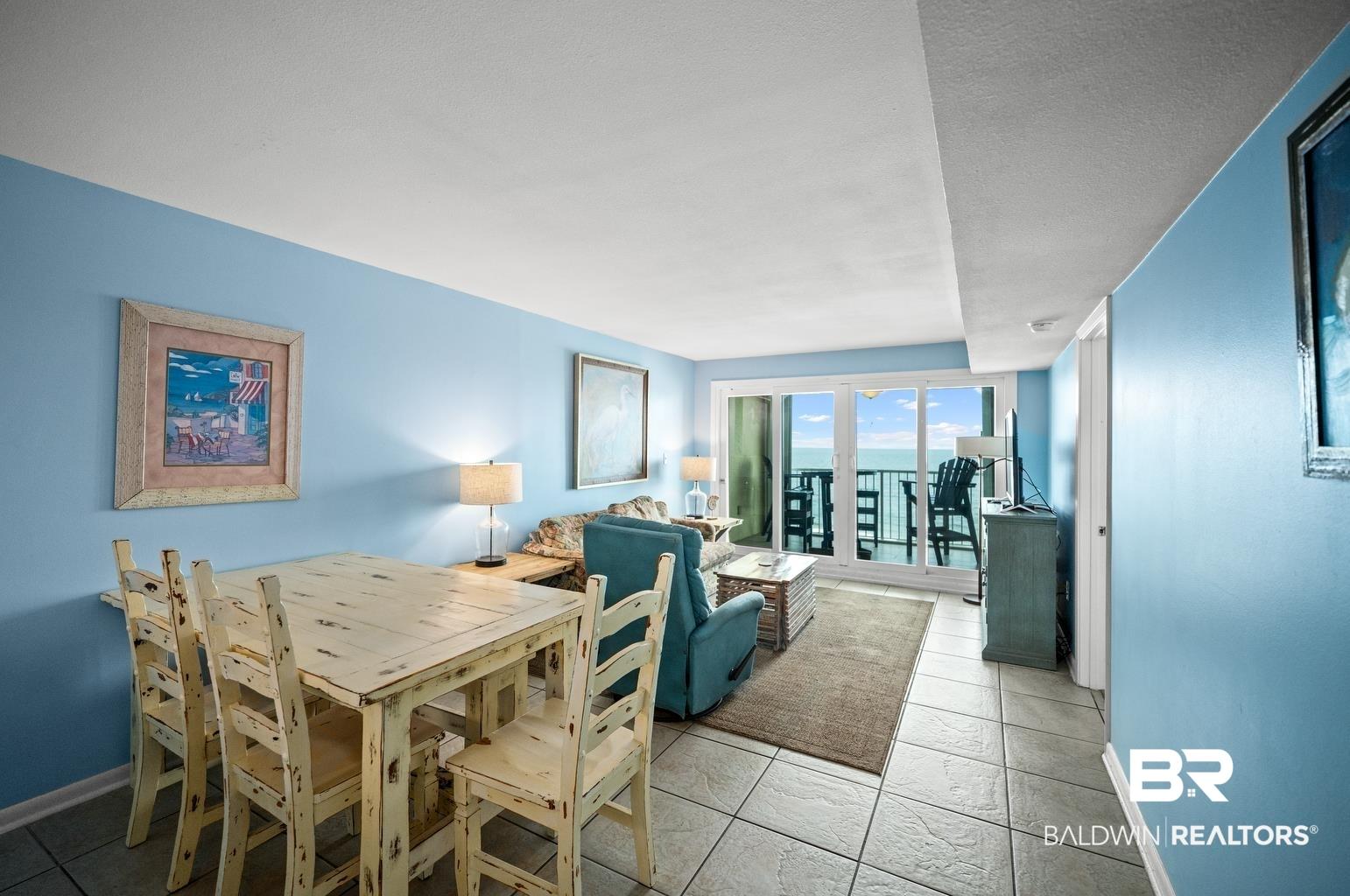 Image 3: Dining space featuring baseboards and light tile patterned floors