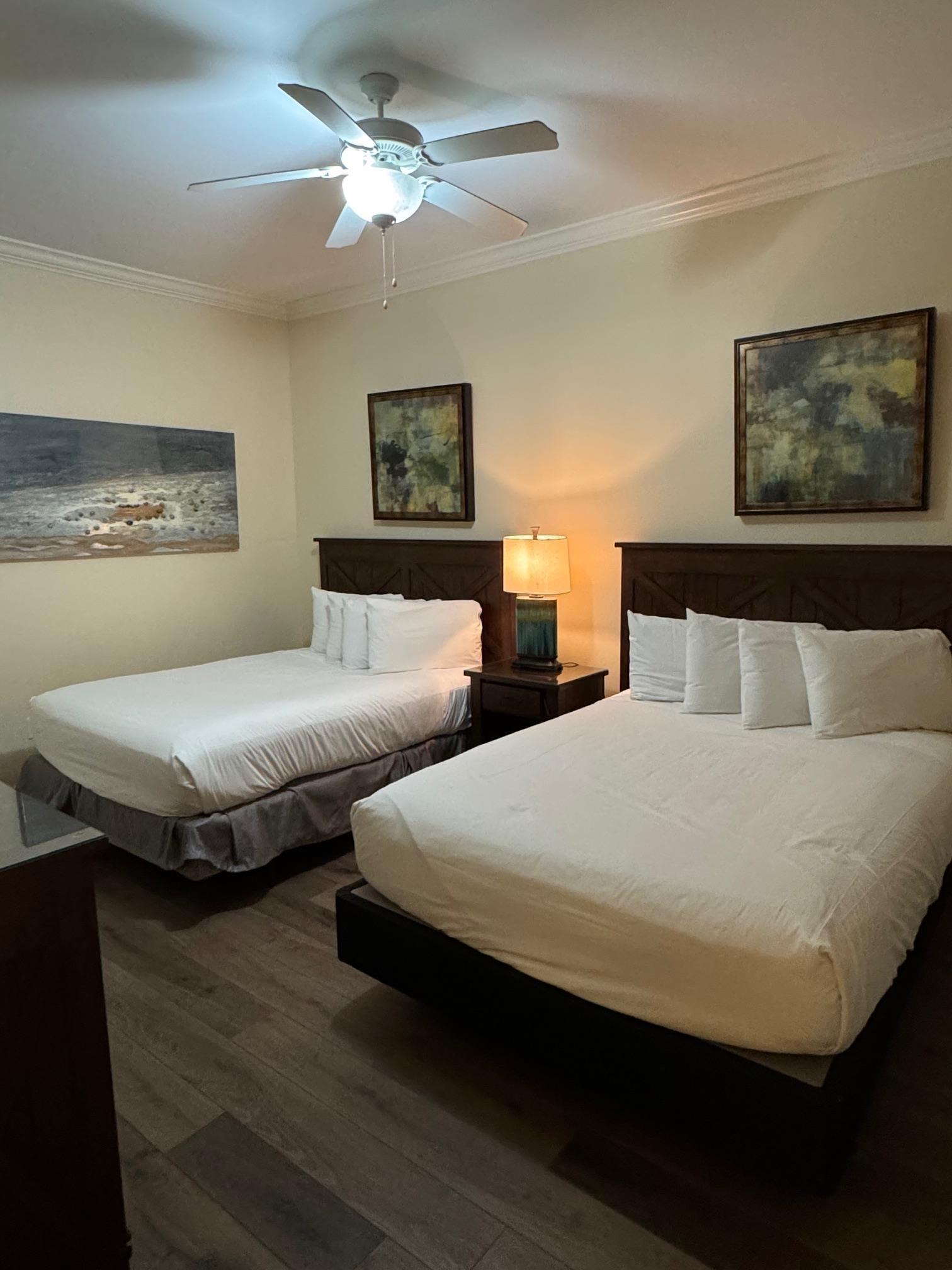 Image 4: Bedroom with ceiling fan, dark hardwood / wood-style flooring, and ornamental molding