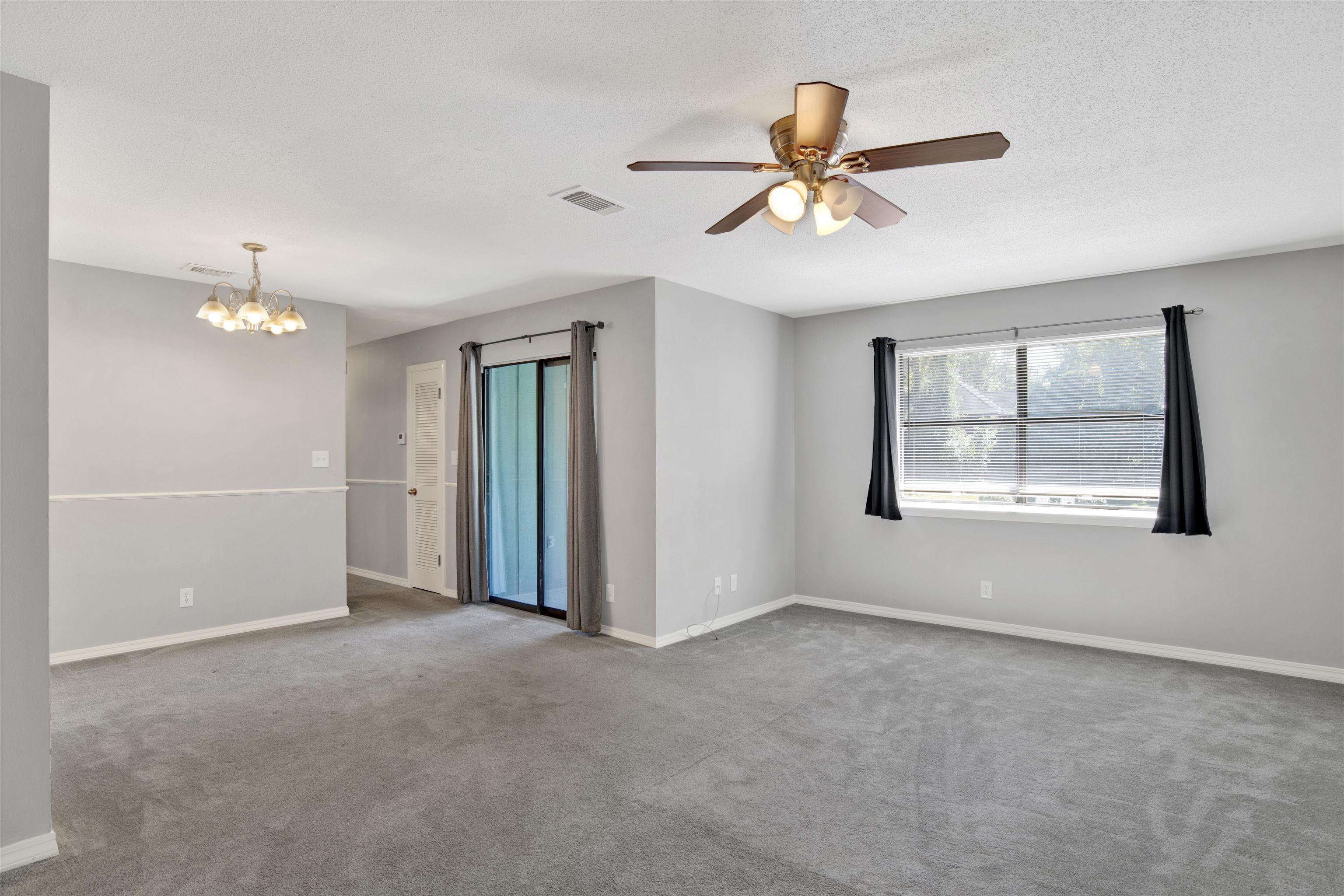 Image 4: Spare room with carpet flooring, a chandelier, a ceiling fan, and a textured ceiling