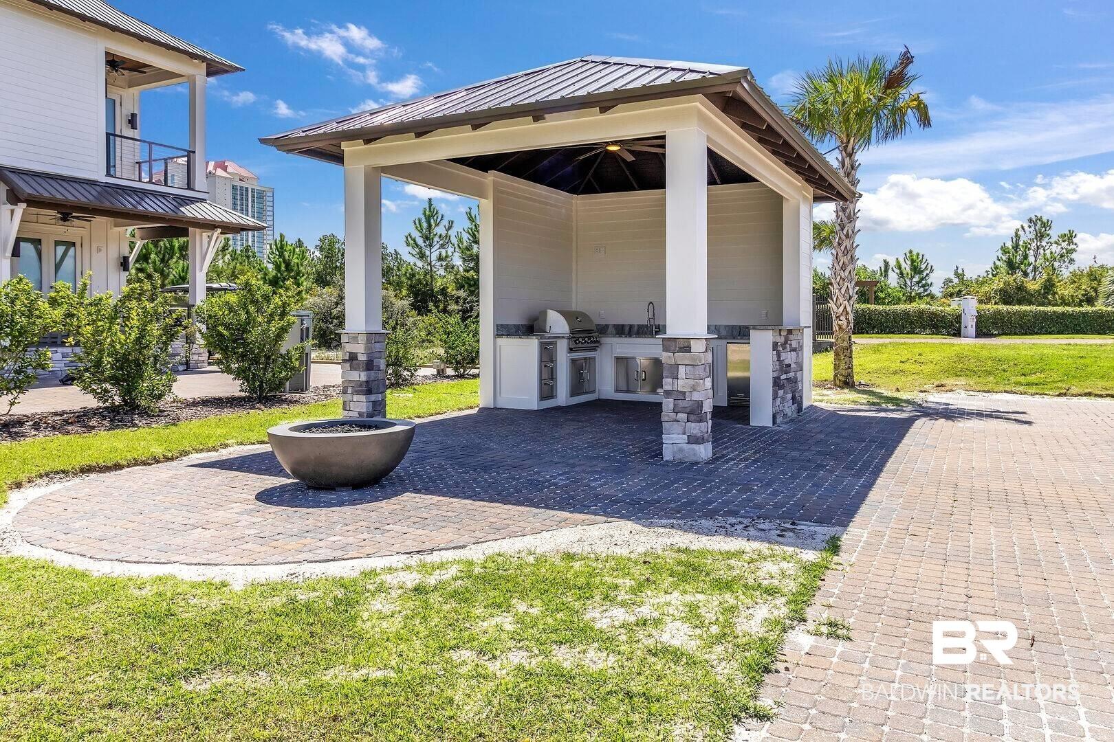 Image 2: View of patio / terrace featuring a ceiling fan, area for grilling, a balcony, and an outdoor kitchen