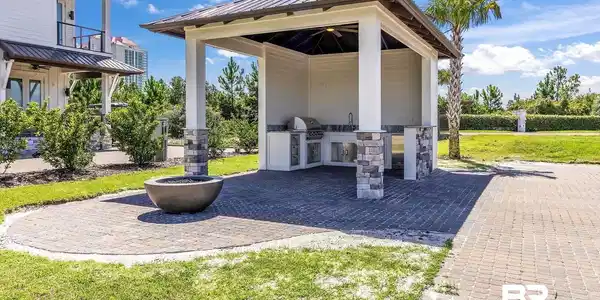 Image 2: View of patio / terrace featuring a ceiling fan, area for grilling, a balcony, and an outdoor kitchen