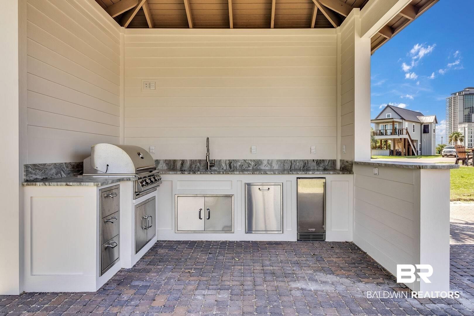Image 4: View of patio / terrace featuring grilling area, area for grilling, and a sink