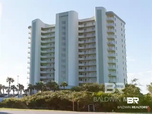 Image 1: View of apartment building / complex