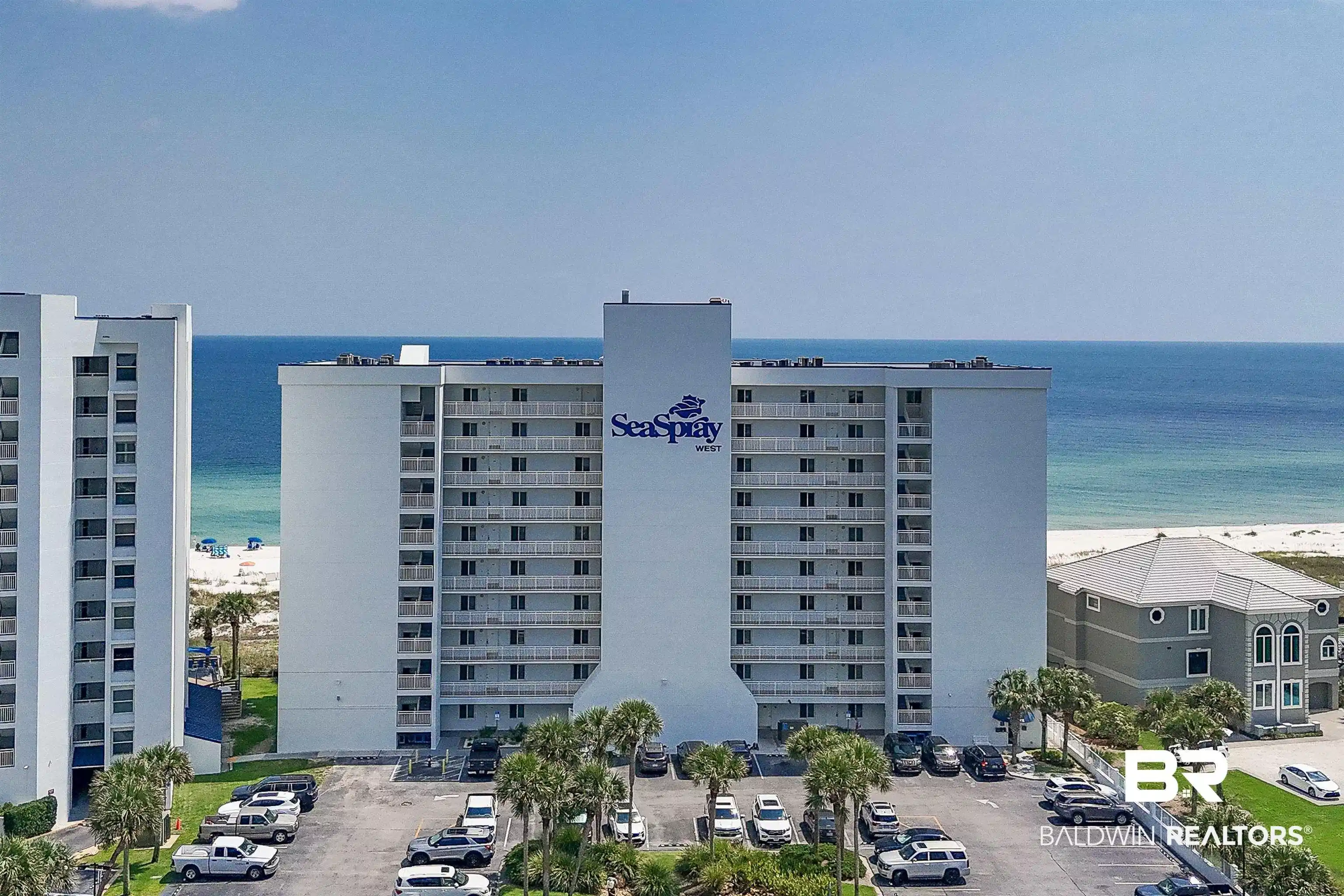 Image 1: Multi-story residential building featuring numerous private balconies with white railings