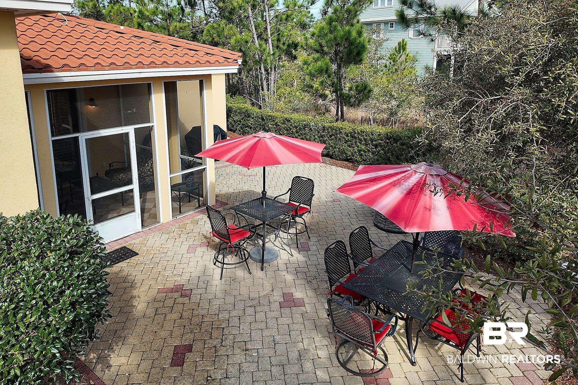 Image 4: View of patio / terrace with outdoor dining space and a sunroom
