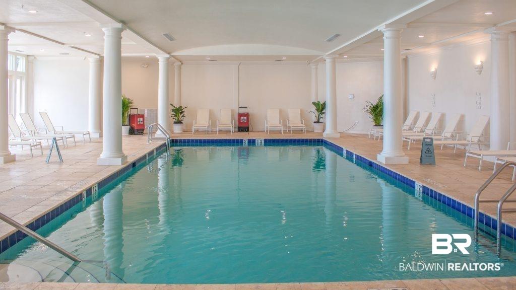 Image 3: View of pool featuring ornate columns