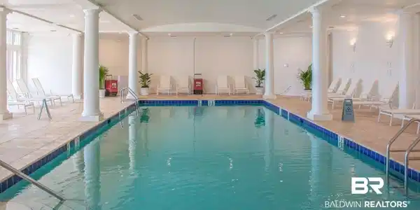 Image 3: View of pool featuring ornate columns