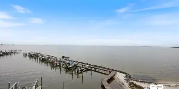 Image 2: Water view with a dock