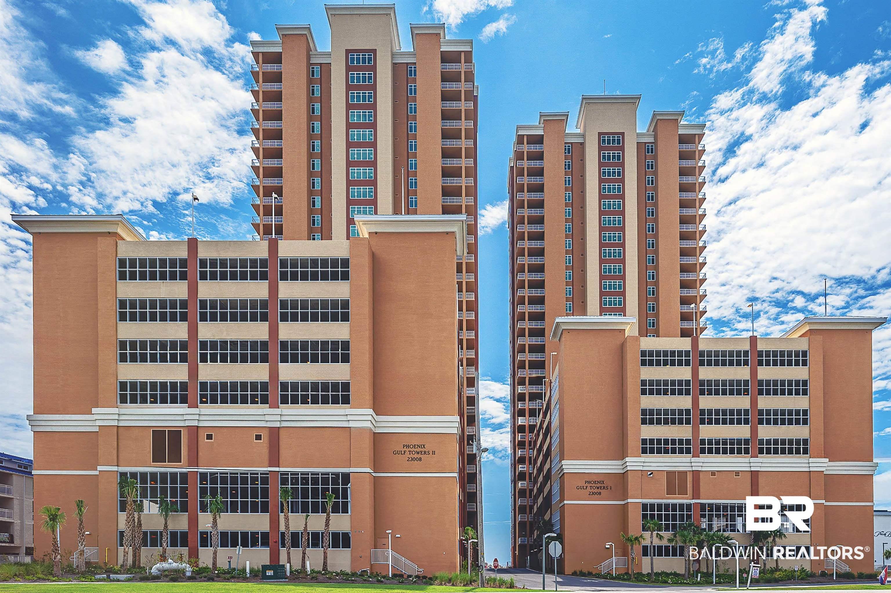 Image 1: Twin high-rise towers featuring numerous balconies and a multi-level parking structure
