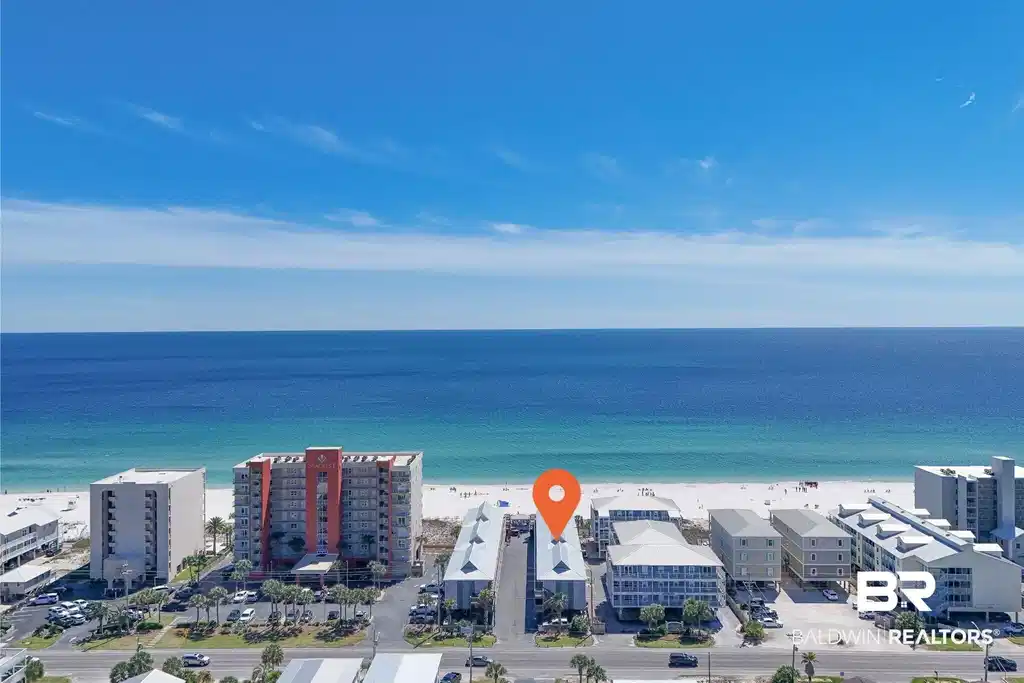 Image 1: Aerial view of apartment complex / building and a nearby body of water