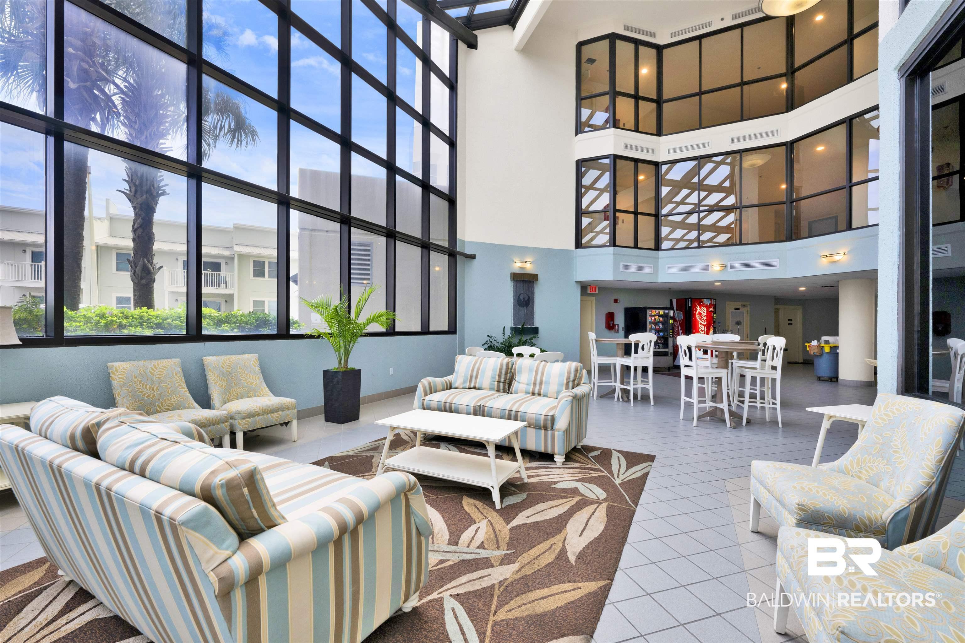 Image 4: Community lobby featuring a high ceiling