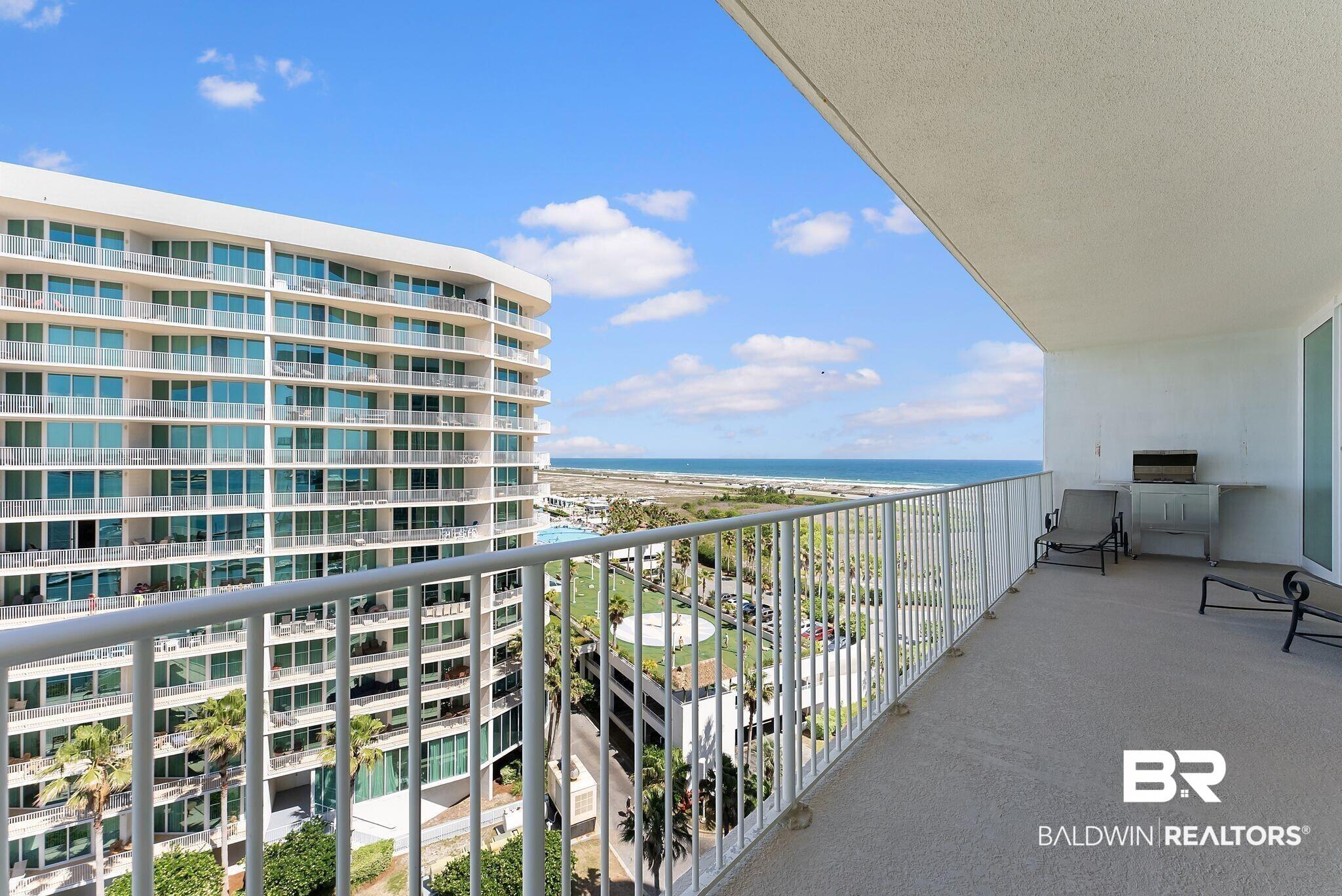 Image 4: Spacious private balcony with expansive water and coastal landscape