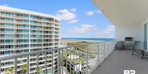 Image 4: Spacious private balcony with expansive water and coastal landscape
