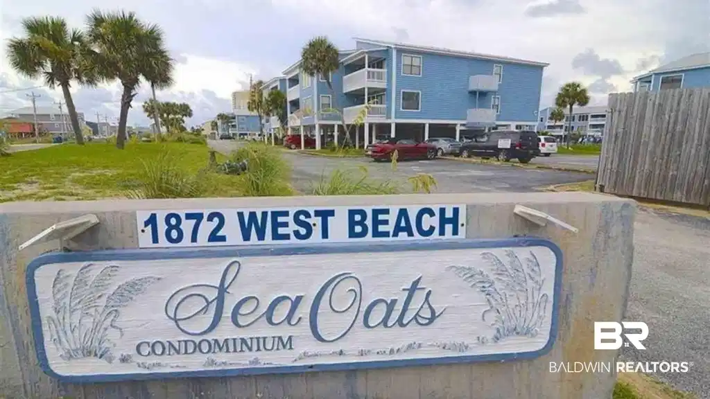 Image 1: Community sign with uncovered parking