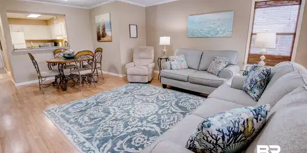 Image 4: Living area featuring ornamental molding, light wood-style flooring, and ceiling fan