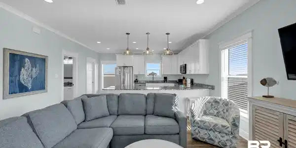 Image 4: Open concept living area featuring wood-finish flooring, recessed lighting, and a ceiling fan