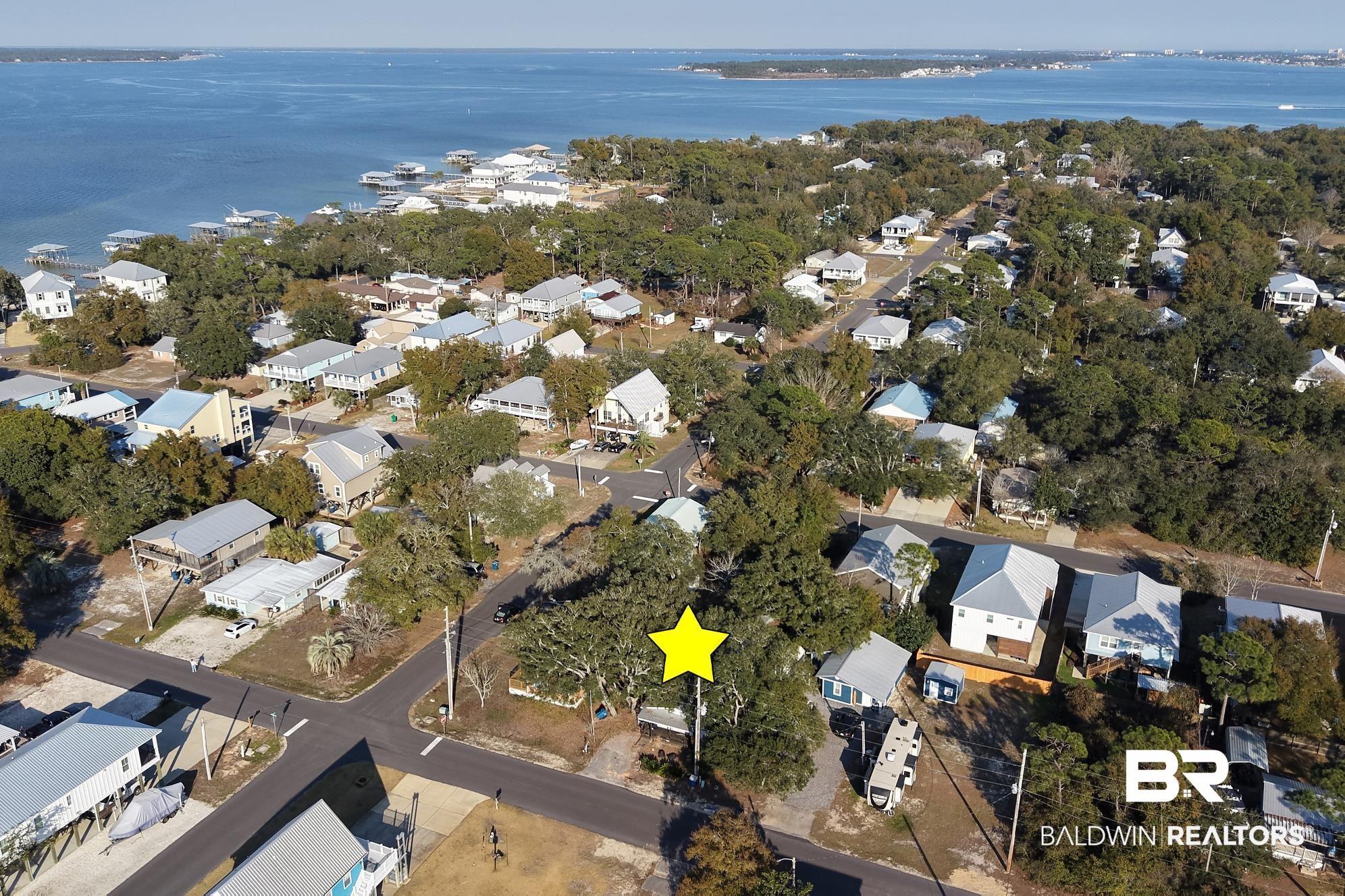 Image 3: Aerial view of property's location with nearby suburban area and a nearby body of water