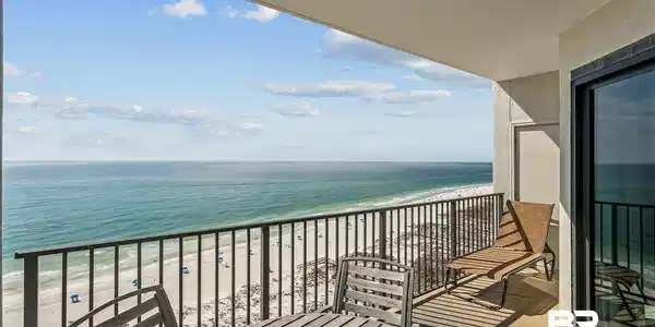 Image 3: Balcony featuring view of water and beach