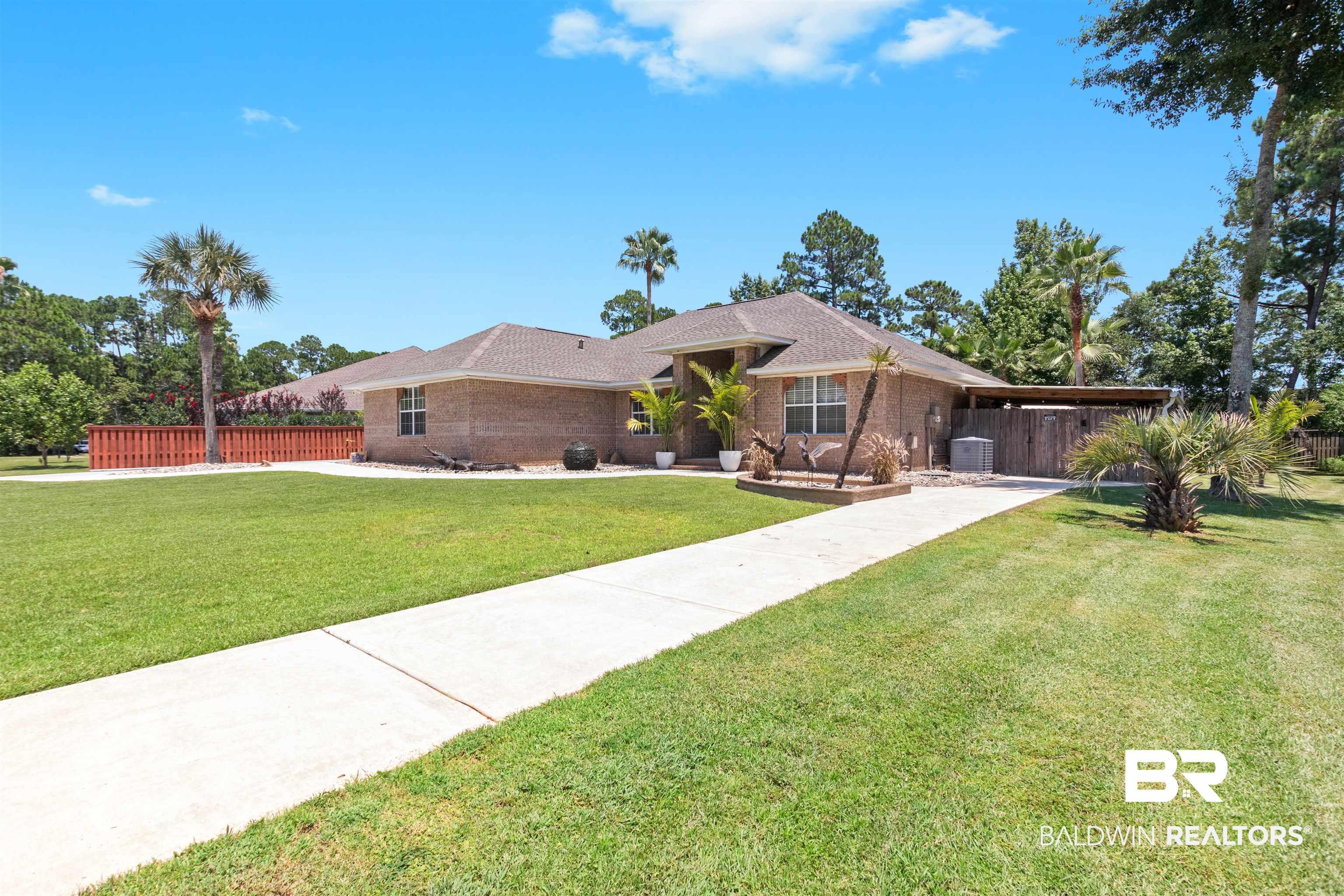 Image 3: Brick exterior residence featuring a brown shingle roof