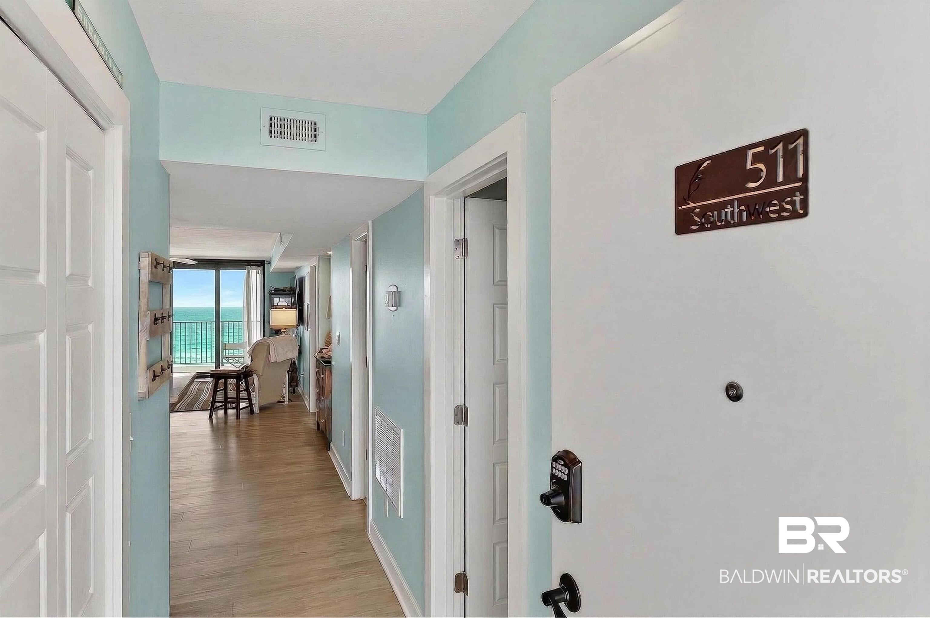 Image 2: Hall with baseboards and light wood-type flooring
