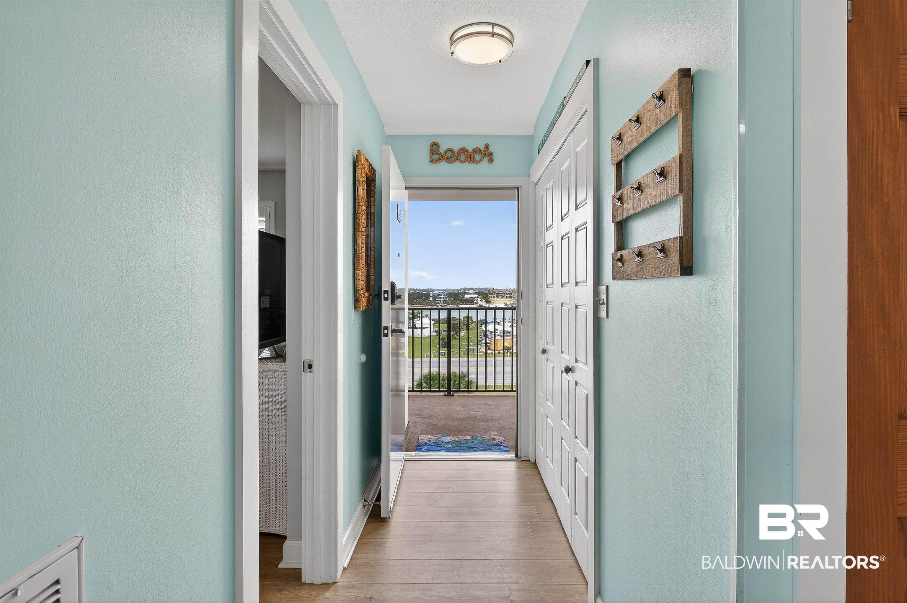 Image 3: Hall featuring light wood-style floors