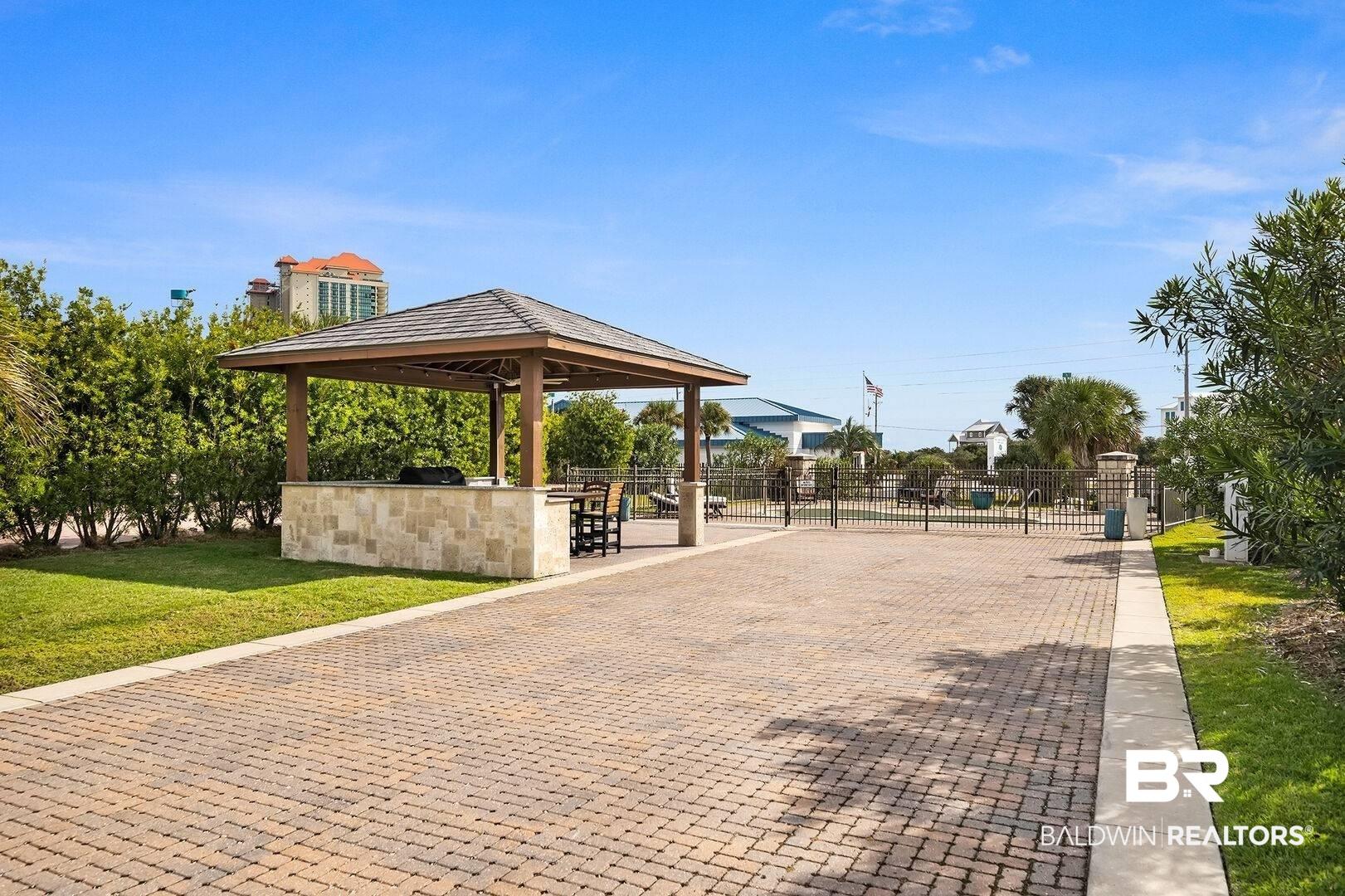 Image 2: View of community with a yard and a gazebo