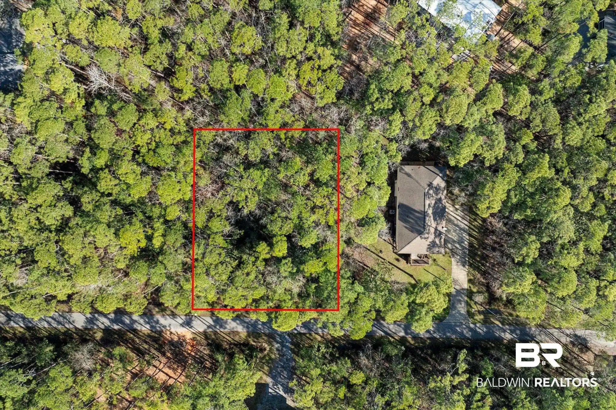 Image 1: Bird's eye view with a wooded view