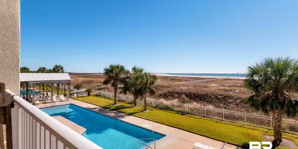 Image 4: Community pool featuring a patio