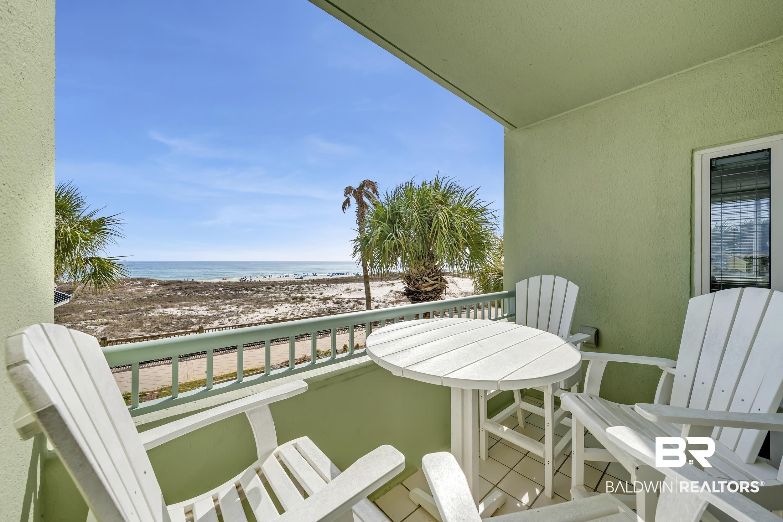 Image 4: Balcony with view of water and beach