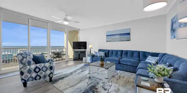 Image 2: Living room featuring expansive windows, wood finished floors, ceiling fan, ornamental molding, and a textured ceiling
