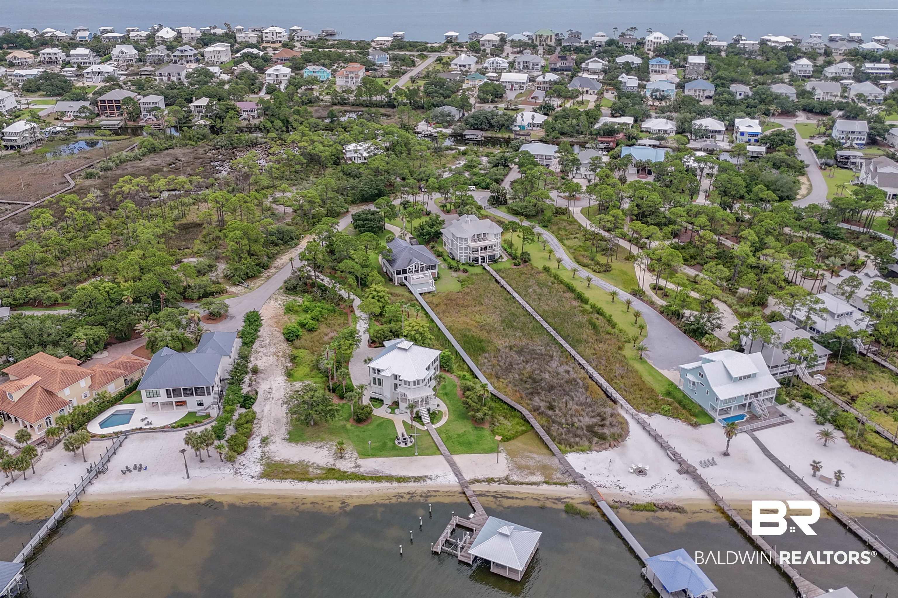 Image 3: Aerial overview of property's location with nearby suburban area and a nearby body of water