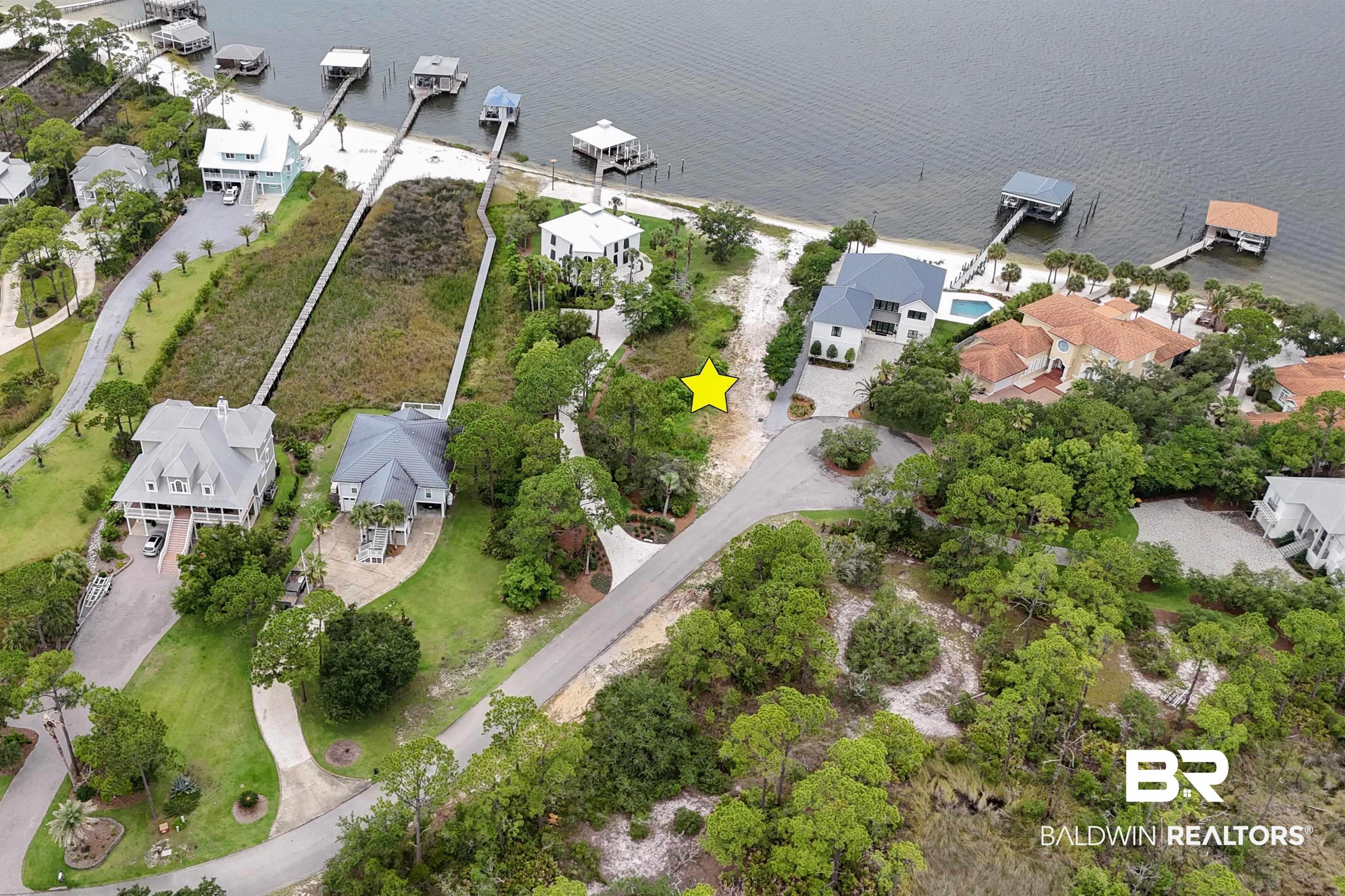 Image 4: Aerial view of property and surrounding area featuring nearby suburban area and a nearby body of water